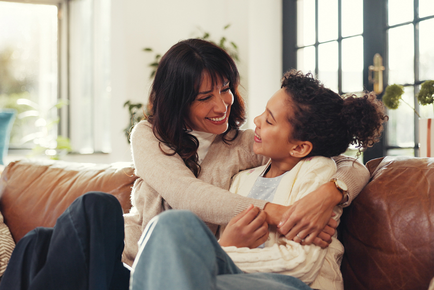 Mother and daughter hugging