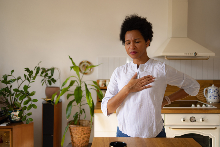Woman holding chest