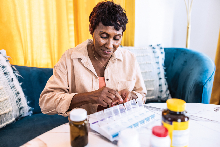 Woman organizing pills