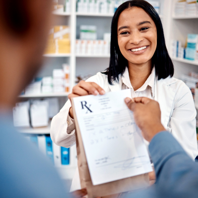 Pharmacist giving medicine to a patient.