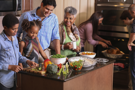 Family cooking a holiday meal together.