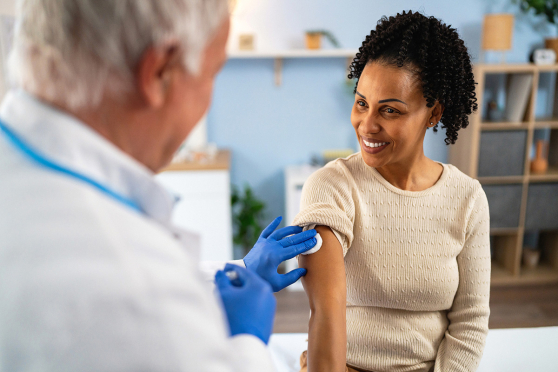 Woman getting a vaccine.