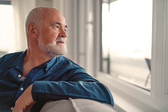 Man looking out the window